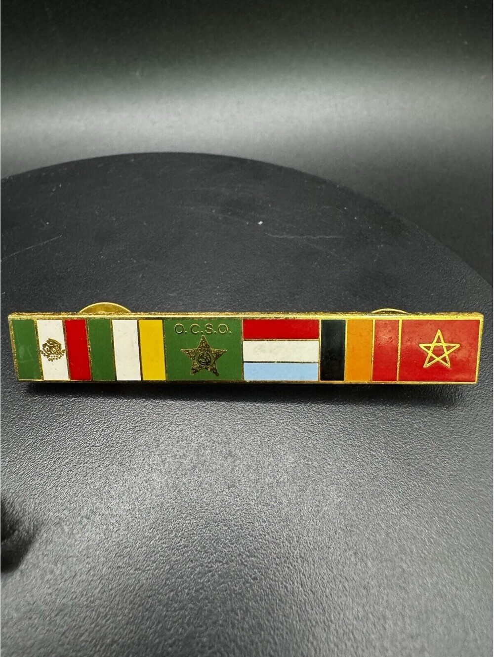 Vintage OCSO Enamel Bar Pin International Flags Star Gold Tone Lapel Badge 2.5"